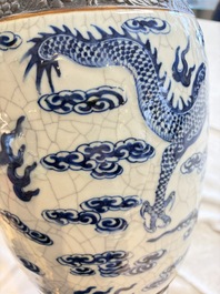 A pair of Chinese blue and white Nanking crackle-glazed 'Dragons' vases, 19th C.