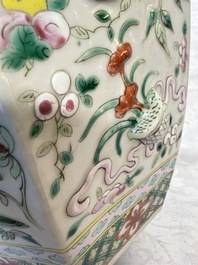 A pair of Chinese famille rose 'Antiquities' vases and covers, 19th C.