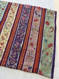 A Chinese embroidered silk red-ground women's robe, 19th C.