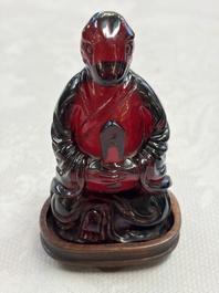 A rare complete set of 12 Chinese cherry amber 'Zodiac' figures on wooden stands, Qianlong mark, Republic