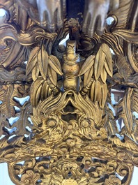 An exceptional Vietnamese gilt-lacquered wood and ivory 'Dragon and Phoenix' throne-shaped altar, 18/19th C.