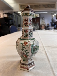 A rare Chinese famille verte puzzle jug with a wooden cover, Kangxi