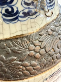 A pair of Chinese blue and white Nanking crackle-glazed 'Dragons' vases, 19th C.