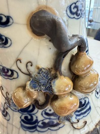 A pair of Chinese blue and white Nanking crackle-glazed 'Dragons' vases, 19th C.