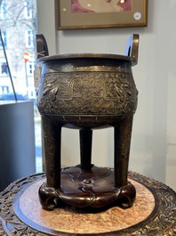 A rare Chinese gold- and silver-inlaid bronze 'Ding' censer with Taotie design on a hongmu stand, Shaosheng 紹聖 and Su Zhe 蘇轍 mark, Song or later