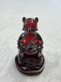 A rare complete set of 12 Chinese cherry amber 'Zodiac' figures on wooden stands, Qianlong mark, Republic