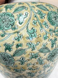 A rare pair of Chinese famille verte yellow-ground 'Flower Scroll' covered vases, Kangxi