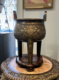 A rare Chinese gold- and silver-inlaid bronze 'Ding' censer with Taotie design on a hongmu stand, Shaosheng 紹聖 and Su Zhe 蘇轍 mark, Song or later