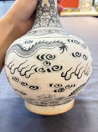 A Chinese black-enamelled biscuit 'Dragon' vase, Kangxi mark, 19th C.