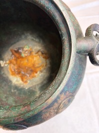 A large Chinese archaistic bronze wine vessel and cover with ram-form handles, Lei 罍, Ming