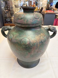 A large Chinese archaistic bronze wine vessel and cover with ram-form handles, Lei 罍, Ming