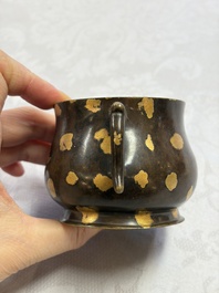 A Chinese gold-splashed bronze censer with two handles, Xuande mark, 18th C.