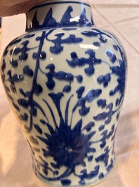 Two Chinese blue and white 'Lotus Scroll' vases and covers, Kangxi