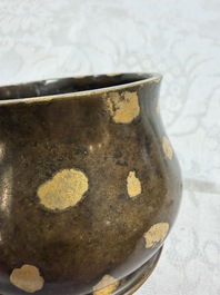 A Chinese gold-splashed bronze censer with two handles, Xuande mark, 18th C.