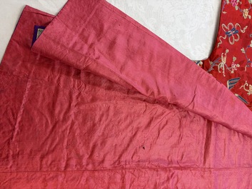 A Chinese embroidered silk red-ground women's robe, 19th C.