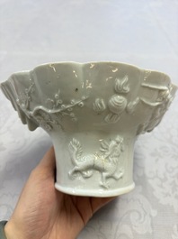 A very large Chinese Dehua blanc de Chine libation cup with a dragon, a qilin, a tiger and a crane, 18th C.