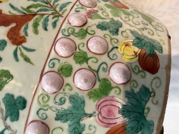 A Chinese famille rose garden seat with butterflies, flowers and fruiting branches, 19th C.