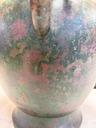 A large Chinese archaistic bronze wine vessel and cover with ram-form handles, Lei 罍, Ming