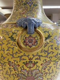 A pair of large Chinese famille rose yellow-ground 'Hu' vases with narrative design, Qianlong mark, Republic