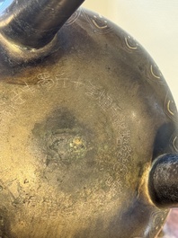 A rare Chinese gold- and silver-inlaid bronze 'Ding' censer with Taotie design on a hongmu stand, Shaosheng 紹聖 and Su Zhe 蘇轍 mark, Song or later