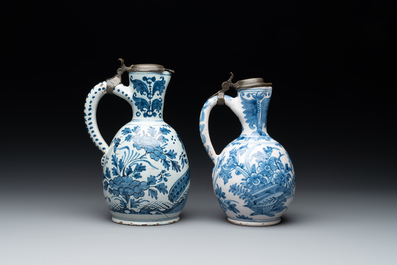 Two blue and white Dutch Delft jugs with pewter lids, 17/18th C.