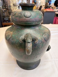 A large Chinese archaistic bronze wine vessel and cover with ram-form handles, Lei 罍, Ming