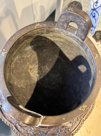 A rare Chinese gold- and silver-inlaid bronze 'Ding' censer with Taotie design on a hongmu stand, Shaosheng 紹聖 and Su Zhe 蘇轍 mark, Song or later