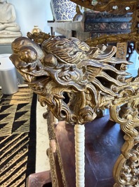 An exceptional Vietnamese gilt-lacquered wood and ivory 'Dragon and Phoenix' throne-shaped altar, 18/19th C.