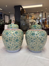 A rare pair of Chinese famille verte yellow-ground 'Flower Scroll' covered vases, Kangxi