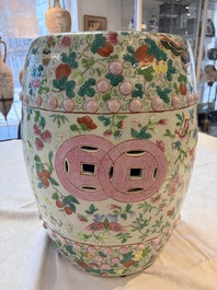A Chinese famille rose garden seat with butterflies, flowers and fruiting branches, 19th C.
