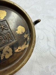 A Chinese gold-splashed bronze censer with two handles, Xuande mark, 18th C.