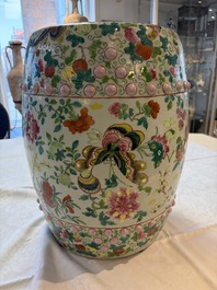 A Chinese famille rose garden seat with butterflies, flowers and fruiting branches, 19th C.