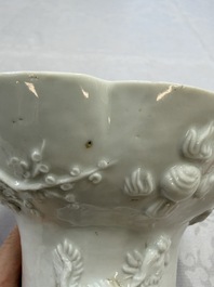 A very large Chinese Dehua blanc de Chine libation cup with a dragon, a qilin, a tiger and a crane, 18th C.