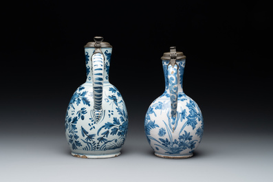 Two blue and white Dutch Delft jugs with pewter lids, 17/18th C.