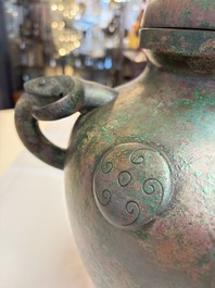 A large Chinese archaistic bronze wine vessel and cover with ram-form handles, Lei 罍, Ming