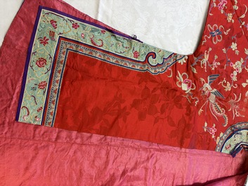 A Chinese embroidered silk red-ground women's robe, 19th C.