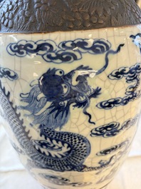 A pair of Chinese blue and white Nanking crackle-glazed 'Dragons' vases, 19th C.