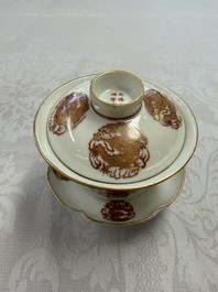 A fine Chinese iron-red gilt-decorated covered teabowl with a stand, Guangxu mark and of the period