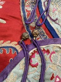 A Chinese embroidered silk red-ground women's robe, 19th C.