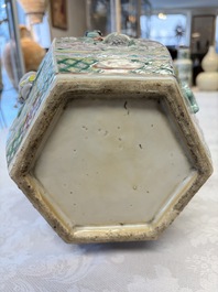 A pair of Chinese famille rose 'Antiquities' vases and covers, 19th C.