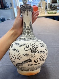A Chinese black-enamelled biscuit 'Dragon' vase, Kangxi mark, 19th C.