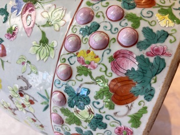 A Chinese famille rose garden seat with butterflies, flowers and fruiting branches, 19th C.