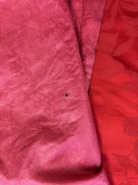 A Chinese embroidered silk red-ground women's robe, 19th C.