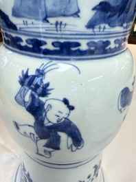 A pair of large Chinese blue and white 'Gu' vases with elegant ladies and playing boys, Kangxi