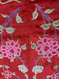 A Chinese embroidered silk red-ground women's robe, 19th C.
