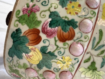 A Chinese famille rose garden seat with butterflies, flowers and fruiting branches, 19th C.