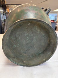 A large Chinese archaistic bronze wine vessel and cover with ram-form handles, Lei 罍, Ming