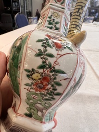 A rare Chinese famille verte puzzle jug with a wooden cover, Kangxi