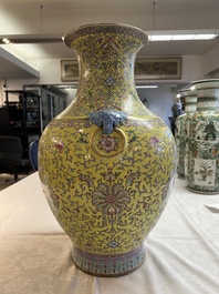 A pair of large Chinese famille rose yellow-ground 'Hu' vases with narrative design, Qianlong mark, Republic