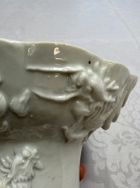 A very large Chinese Dehua blanc de Chine libation cup with a dragon, a qilin, a tiger and a crane, 18th C.